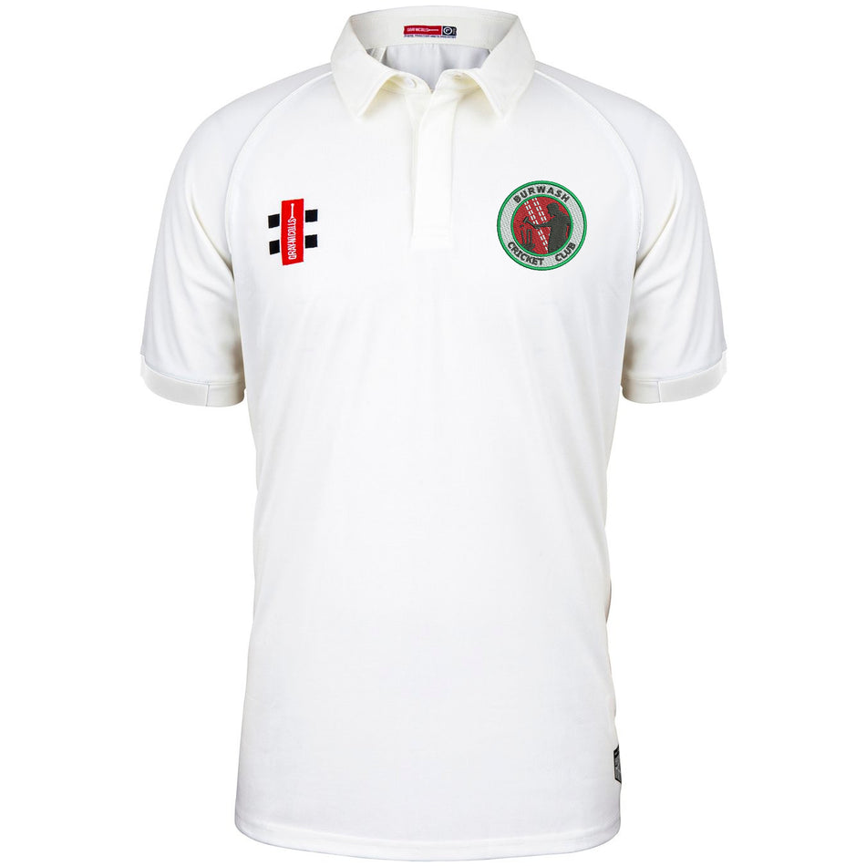 The Burwash CC Matrix V2 Short Sleeve Match Shirt by Martin Berrill Sports is a white polyester cricket shirt with a collar, featuring two embroidered logos—one circular green/red on the left chest and one rectangular red/black on the right.
