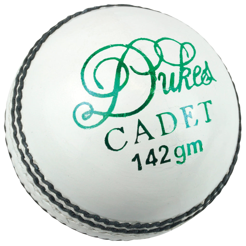 A white Dukes Cadet A Cricket Ball (Junior) featuring black stitching and green "Dukes Cadet" text, designed by the brand Dukes.