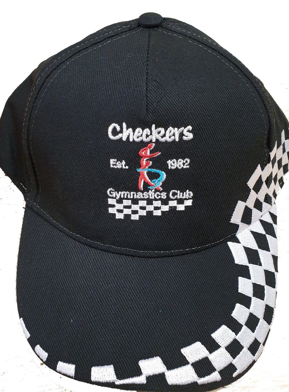 The Checkers Gymnastics Cap by Martin Berrill Sports is a black adjustable cap featuring “Checkers Est. 1982 Gymnastics Club” embroidery, a colorful gymnast figure, and a white checkered pattern on the brim and side.