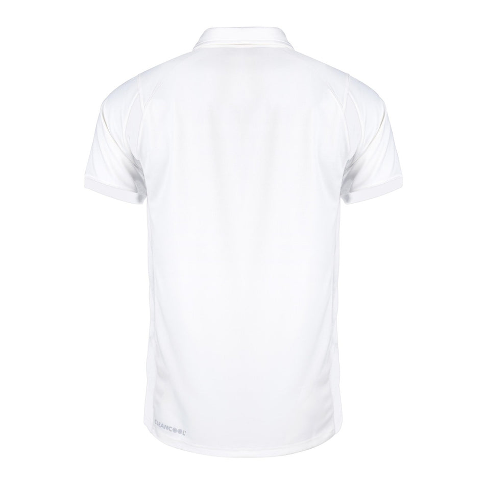 White short-sleeve collared shirt shown from the back, featuring a plain design with no visible patterns or logos except for a subtle "Rockhampton CC Pro Performance Short Sleeved Shirt - Junior" marking by Gray Nicolls near the bottom hem.