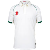The Gray Nicolls Matrix V2 S/S Cricket Shirt is a white, regular fit shirt with green trim on the sleeves and shoulders, a collar, and a red and black logo on the left chest. It offers comfort and moisture control for cricket players.