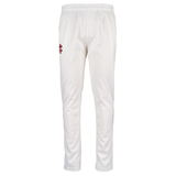 Gray Nicolls Matrix V2 Slim Fit Trousers by Gray Nicolls feature an elastic waistband, side pockets, a small red and black logo on the upper left thigh, and an ergonomic slim fit design, displayed on a plain white background.