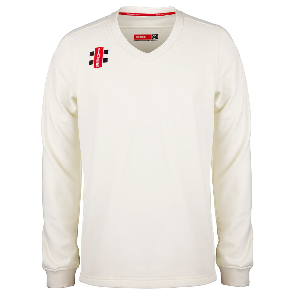 The Gray Nicolls Rockhampton CC Pro Performance Sweater - Junior is a long-sleeved, cream V-neck cricket sweater with a minimal design and small black and red club logos on the right chest and below the collar.