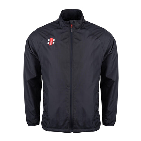 The Gray Nicolls Velocity Rain Jacket is a black, lightweight, water-repellent zip-up with a high collar and long sleeves. It features a small red and white rectangular logo on the left chest—ideal for staying dry at cricket matches.
