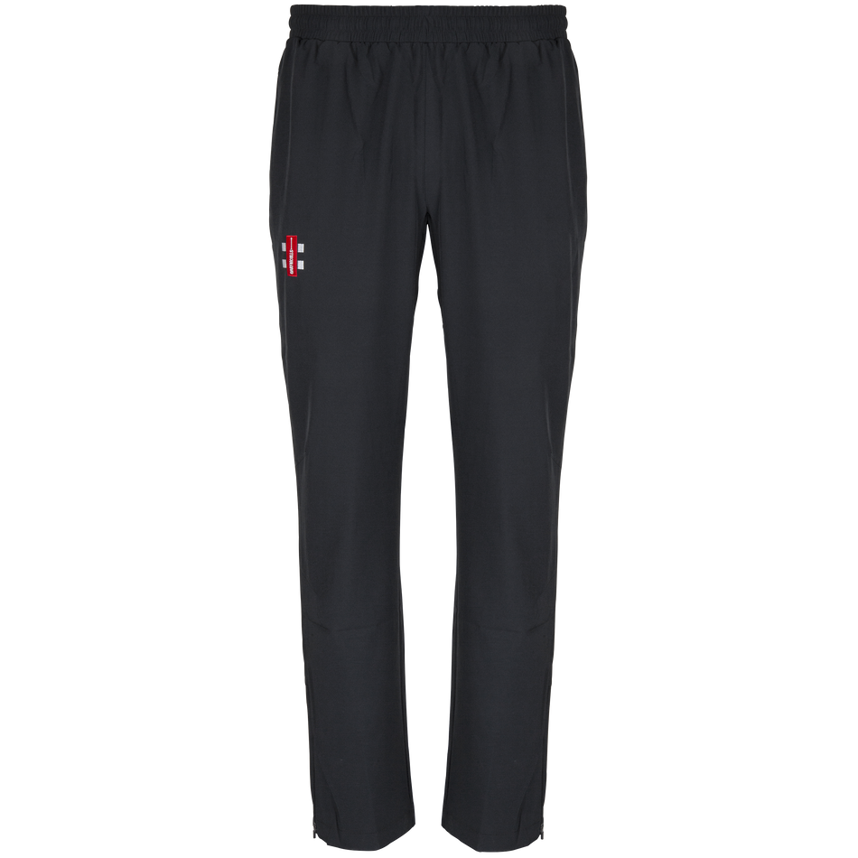 The Gray Nicolls Woolhope CC Velocity Track Trouser features an athletic fit, elastic waistband, and a red and white England cricket logo on the upper left thigh. These black trousers offer four-way stretch for comfort, shown on a plain white background.