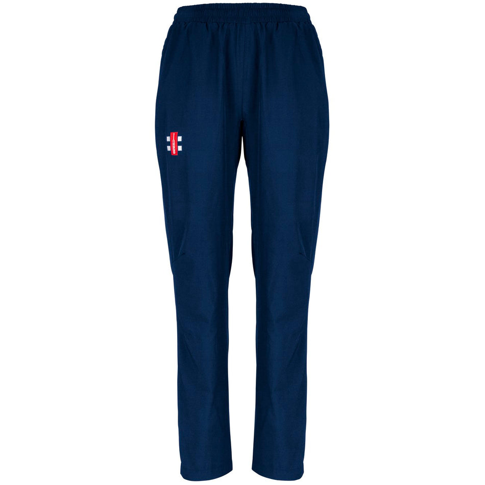 Gray Nicolls Velocity Ladies Track Trousers feature a regular fit in navy blue, an elastic waistband, and a small red and white logo on the upper left thigh. Made from lightweight fabric, these stylish pants have no visible pockets or drawstrings.
