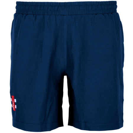 The Gray Nicolls Velocity Shorts in navy feature an elastic waistband, side pockets, and a red-and-white logo patch on the lower left leg. These cricket training shorts offer a simple, sporty design from Gray Nicolls.