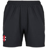 The Gray Nicolls Velocity Ladies Shorts are black athletic shorts with an elastic waistband, mesh lining, side pockets, and a red and white patch on the lower left leg—lightweight and perfect for sporty, durable wear.