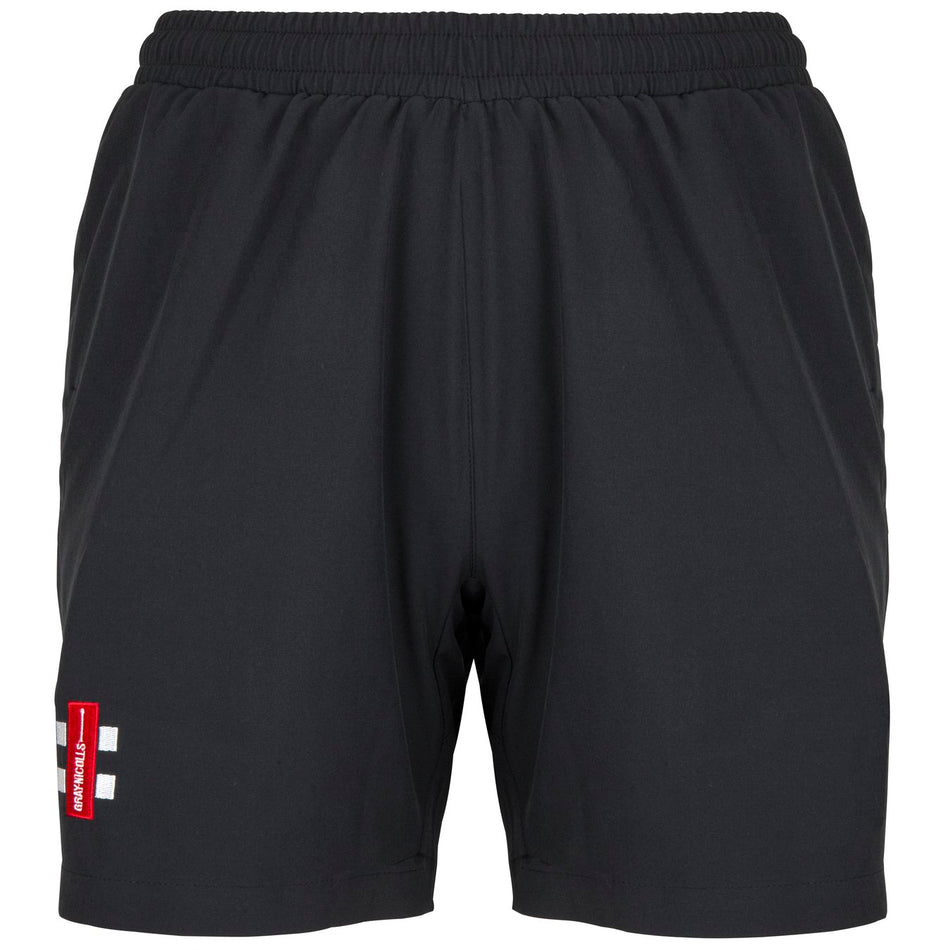 The Gray Nicolls Velocity Ladies Shorts are black athletic shorts with an elastic waistband, mesh lining, side pockets, and a red and white patch on the lower left leg—lightweight and perfect for sporty, durable wear.
