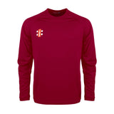 The Gray Nicolls Matrix V2 Long Sleeve T-Shirt is a maroon athletic top with moisture wicking fabric and a small red and white logo on the upper left chest, ideal for training. Shown against a white background.
