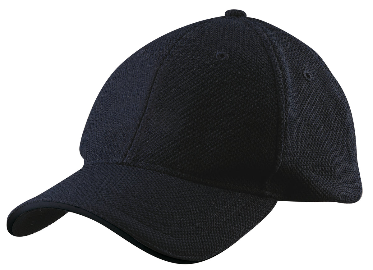 The Gray Nicolls Cricket Cap in navy features a curved brim and adjustable fit, shown from a front and left angle on a white background. Crafted from durable polyester, it offers comfort and style.