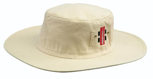The Gray Nicolls Sun Hat is a cream cotton hat with a flat crown and ventilation eyelets, featuring a red and white rectangular Gray Nicolls tag on the side.