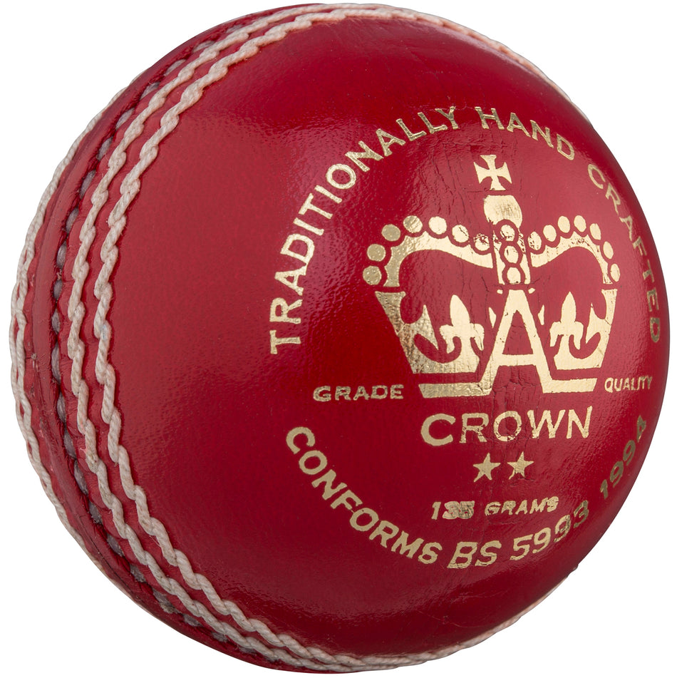 The Gray Nicolls Crown 2 Star Cricket Ball is a red leather ball with white stitching and gold text, featuring a crown logo. Traditionally hand crafted, weighs 156g, ideal for junior cricket, and conforms to BS 5994:1994.