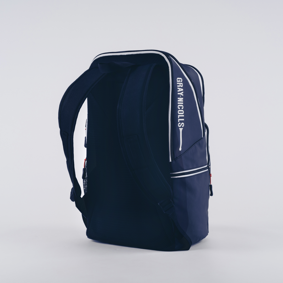 The Gray Nicolls Team Rucksack 2026 is a navy blue backpack with white accents, padded shoulder straps, and the brand name printed vertically on the side. It stands upright against a plain white background.