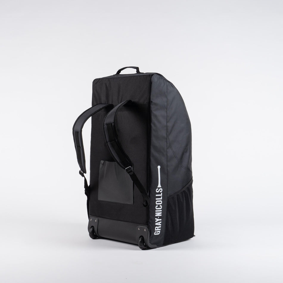 The Gray Nicolls Coach Bag 2026 is a large black bag with backpack straps, a top handle, and the white GRAY-NICOLLS logo on the side. Perfect for organizing coaching gear, it's ideal as a training equipment bag. Shown upright against a plain white background.