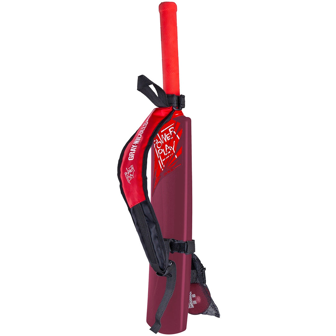 A red and maroon Gray Nicolls junior cricket bat with white "Power Play" text, red grip, and a black-and-red strap case—part of the Gray Nicolls PowerPlay Plastic Bat and Ball Set.