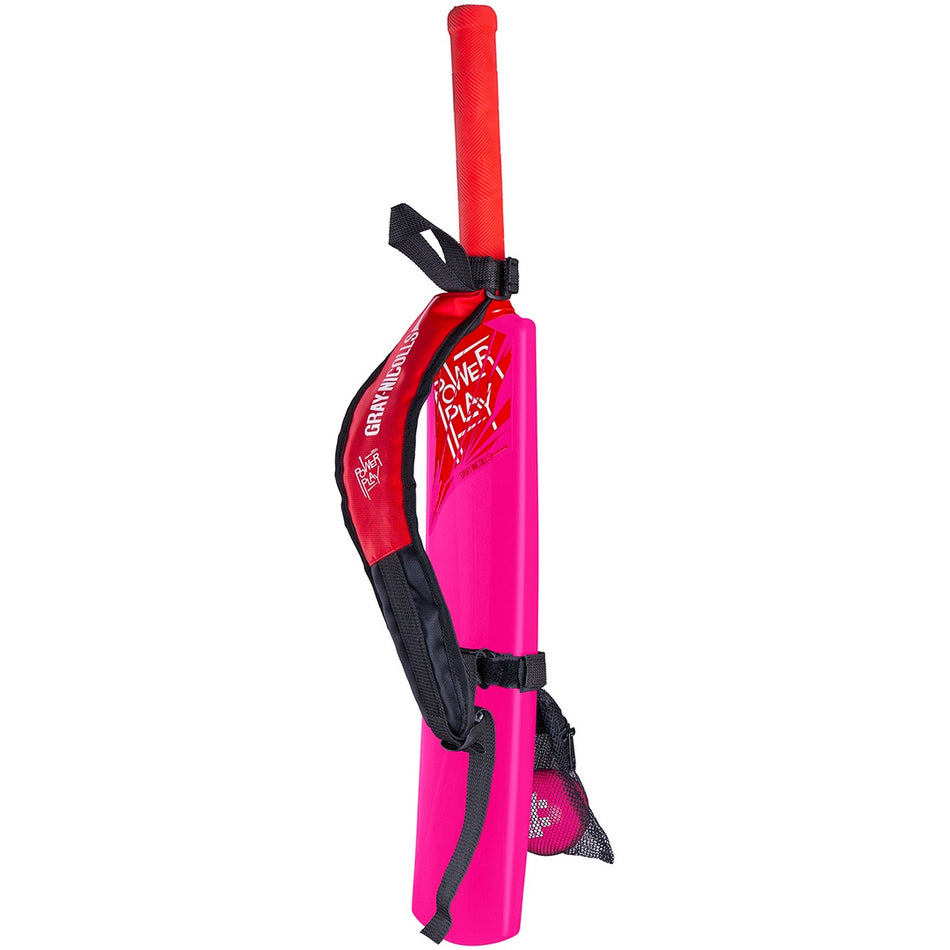 The Gray Nicolls PowerPlay Plastic Bat and Ball Set is a bright pink junior cricket set featuring a red-handled bat, matching carry strap, mesh pocket, and pink cricket ball—all from Gray Nicolls.