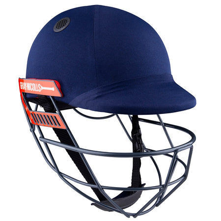 The Gray Nicolls Junior Ultimate 360 Helmet in navy features a metal face guard, red side branding, ventilation holes, and adjustable straps for secure comfort.
