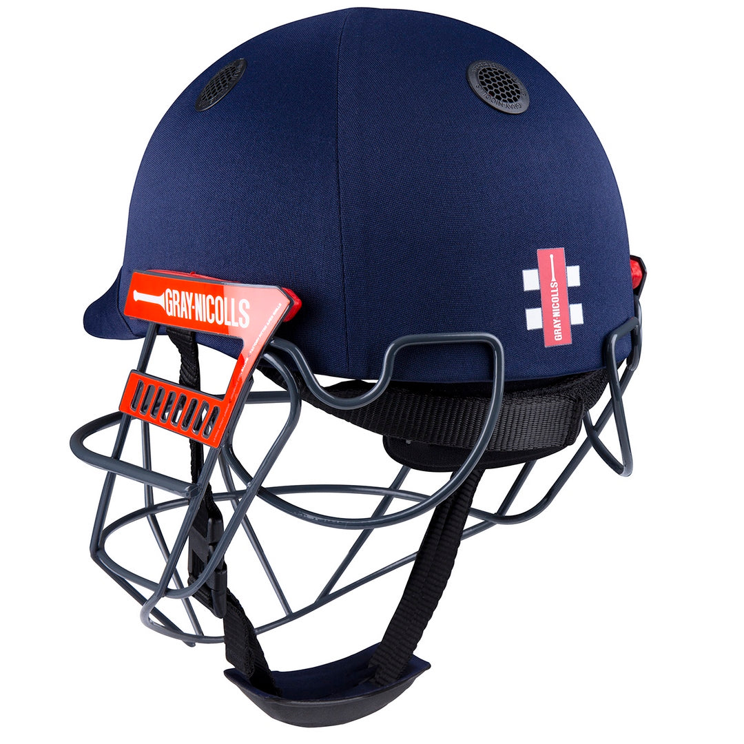 The Gray Nicolls Junior Ultimate 360 Helmet is a navy blue cricket helmet with a black metal 360 faceguard, red and white Gray Nicolls branding on the side, and two ventilation holes on top.