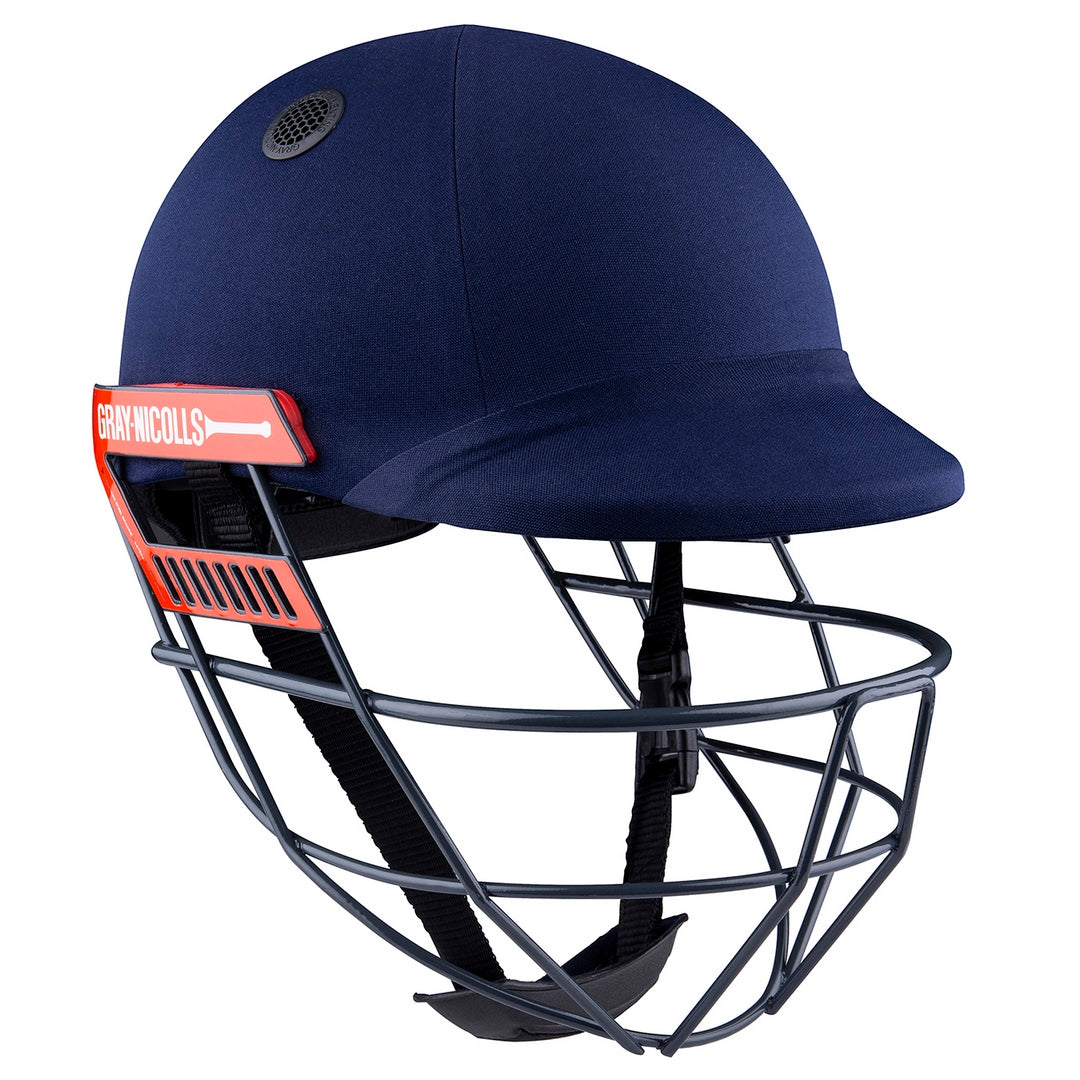 The Gray Nicolls Ultimate Helmet in navy features a red and white logo, metal face grill, adjustable chin strap, and Test Match protection for top-level safety.