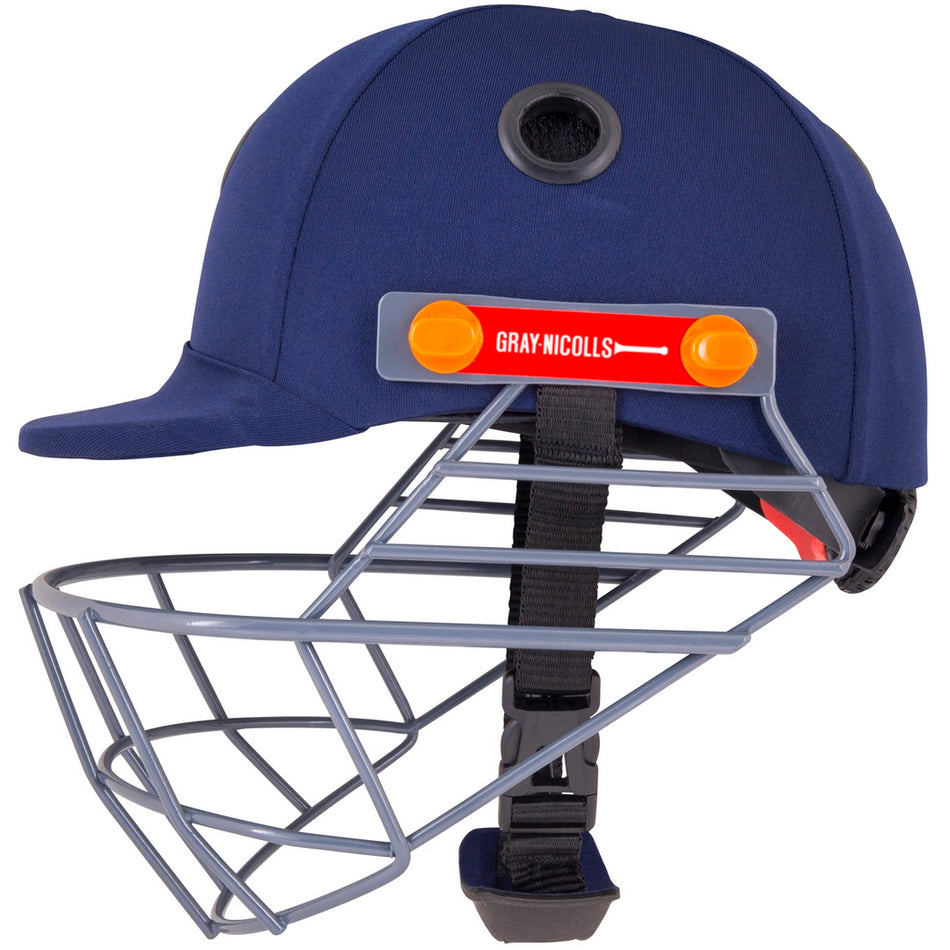 The Gray Nicolls Elite Junior Helmet is a navy blue hardball cricket helmet with a metal face guard, chin strap, and red Gray Nicolls logo on the front held by two orange clips.