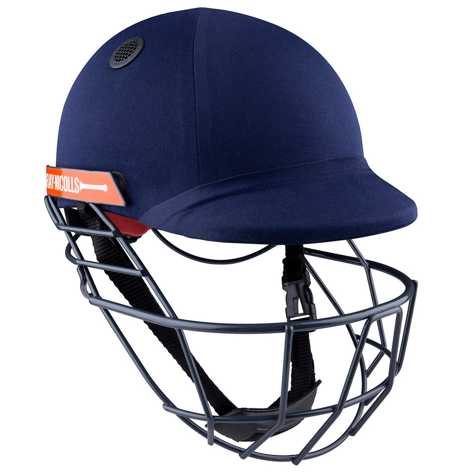 The Gray Nicolls Atomic 360 Helmet in navy features a protective metal face guard, black chin strap, top ventilation, and an orange NICHOLLS side label—a premium choice for cricket protection.