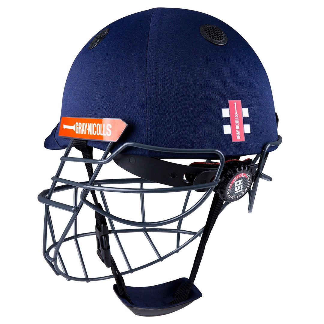 The Gray Nicolls Junior Atomic 360 Helmet is a navy blue cricket helmet with a metal face guard, adjustable chin strap, and Gray Nicolls branding on the side.