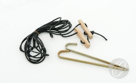 The Harrod Sport Spare Guylines -7.3M, featuring a black cord, two wooden tensioners, and two iron pegs, are displayed on a white background.