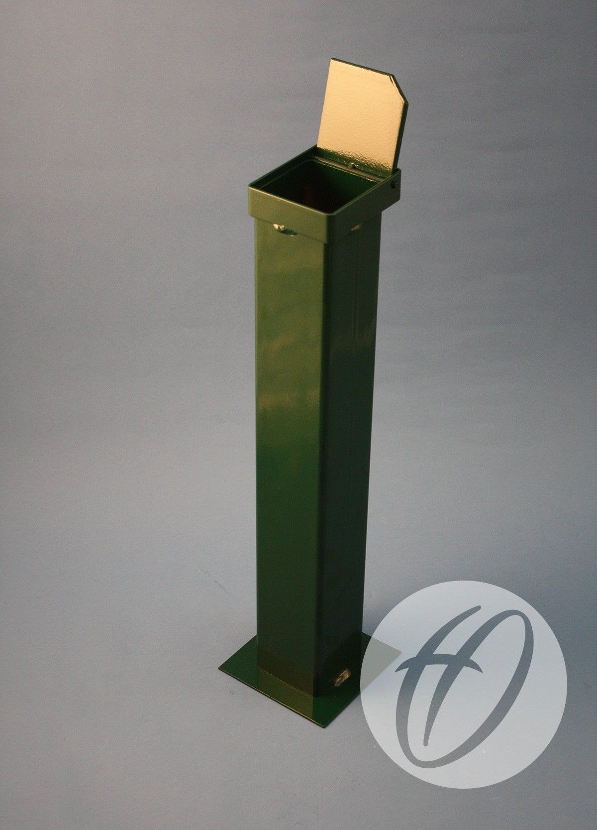 A tall, green metal Socket C/w Hinged Lid by Harrod Sport stands upright on a flat base against a plain gray background. A 90mm diameter socket and an open hinged lid are visible, along with an HD circular logo in the lower right corner.