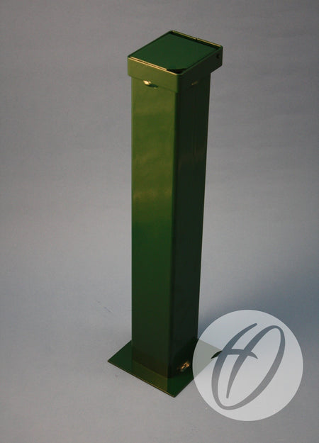A tall, rectangular green metal post by Harrod Sport stands upright on a gray surface. Its base has mounting holes and includes a 90mm diameter Socket C/w Hinged Lid near the lower right, next to a circular H logo.