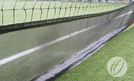 Close-up of Harrod Sport Braided Cricket Netting - 3.6M High W/ Vermin Skirt, showing durable mesh similar to tennis nets, with a white line and optional vermin skirt for extra protection.