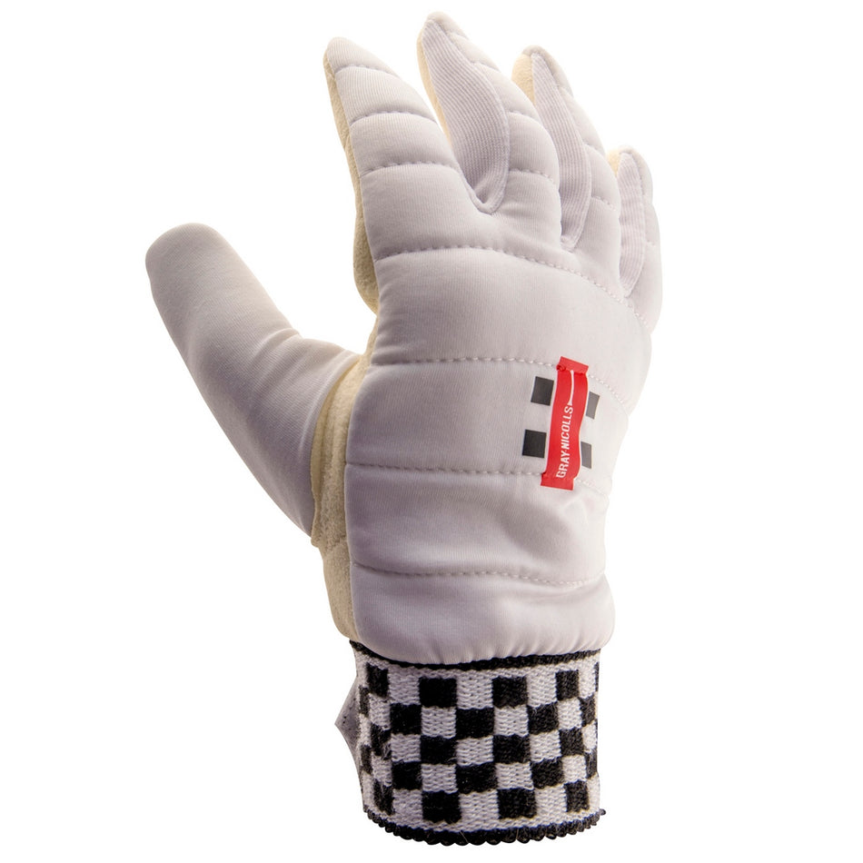 The Gray Nicolls Legend XRD Wicket Keeping Inners feature a padded white glove with quilted stitching, a leather palm, red tag, and a black-and-white checkered wristband, shown upright with fingers slightly curled.