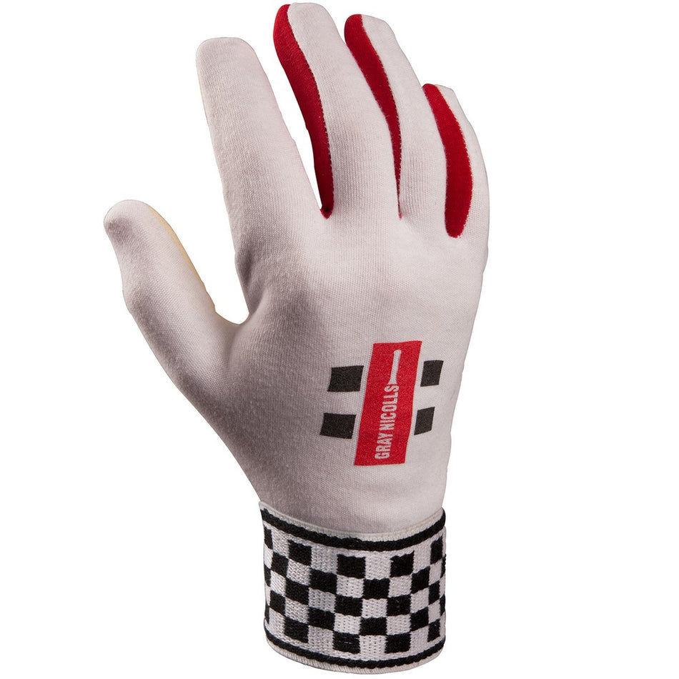 The Gray Nicolls Chamois Padded Palm Wicket Keeping Inners feature a white design, red-tipped fingers, black and white checkerboard cuff, padded chamois palm, and GRAN FOCUS logo—perfect for comfort and grip.