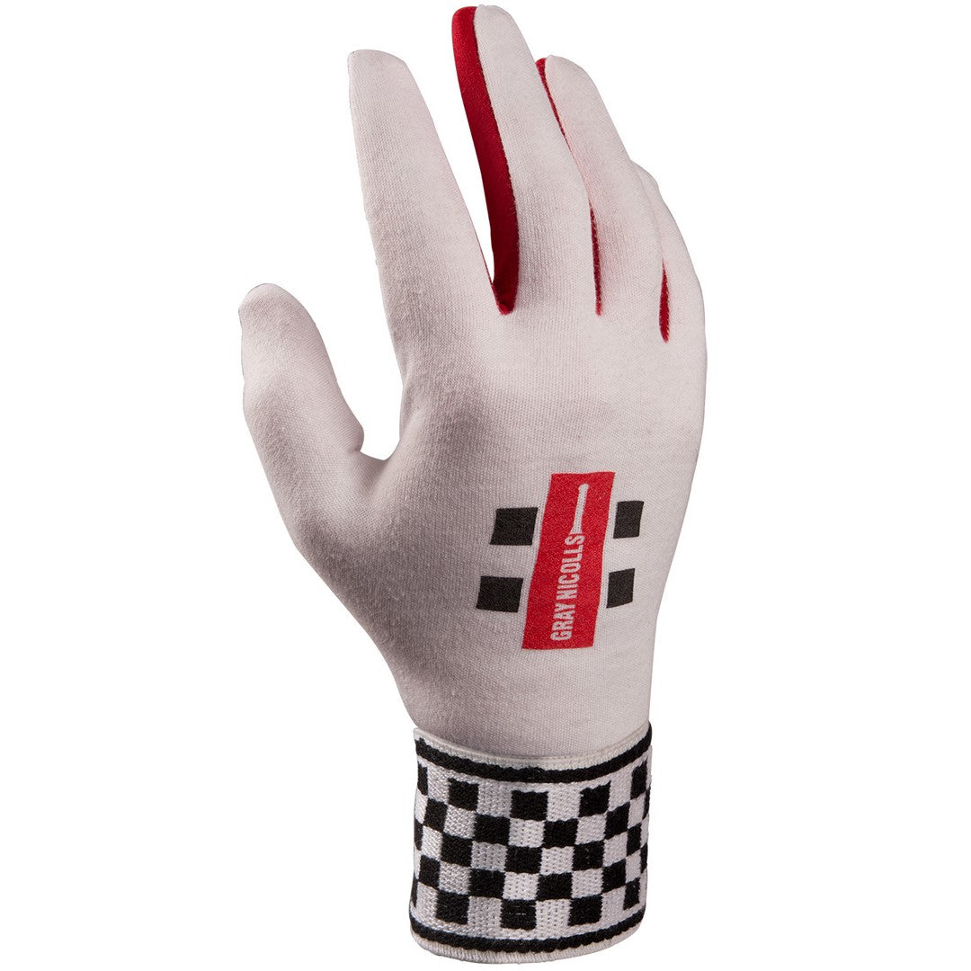 The Gray Nicolls Cotton Plain Palm Wicket Keeping Inners feature a white design with a red stripe between the fingers, black checkered wrist patterns, a gray nicolls style red logo, GRAN TURISMO text on the back, and a cotton palm for comfort.