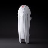 The Gray Nicolls Legend Wicket Keeping Pads 2026, featuring an ergonomic knee design and subtle logo near the top, stands upright on a dark background highlighting its white padding and secure straps.