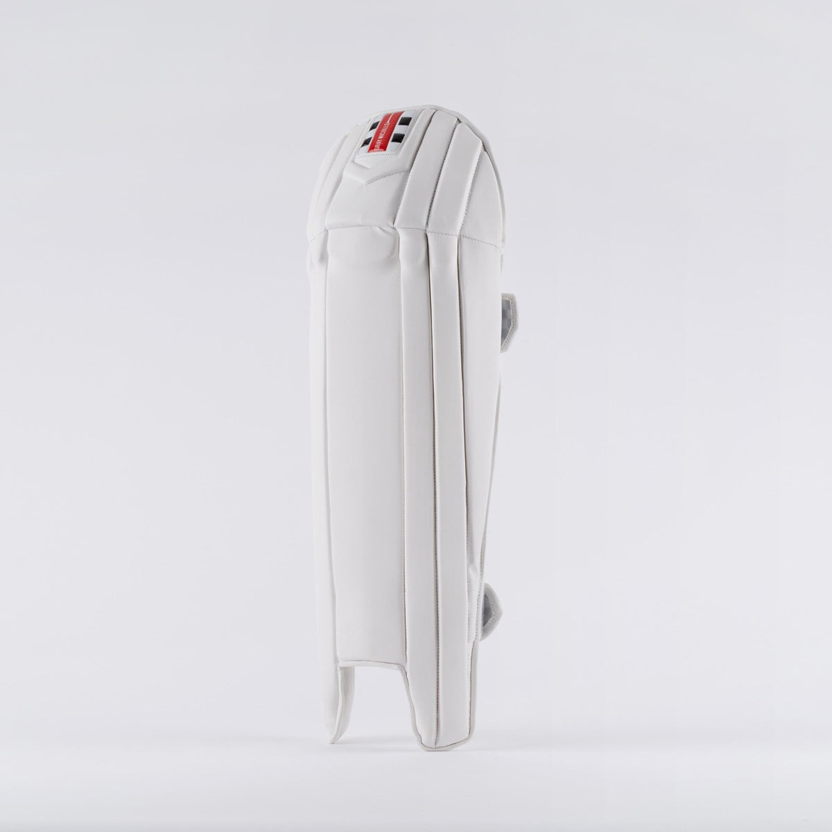 The Gray Nicolls Prestige Wicket Keeping Pads 2026 stands upright against a plain background, showcasing ergonomic knee design, detailed padding and stitching, and a small tricolor Gray Nicolls logo near the top.