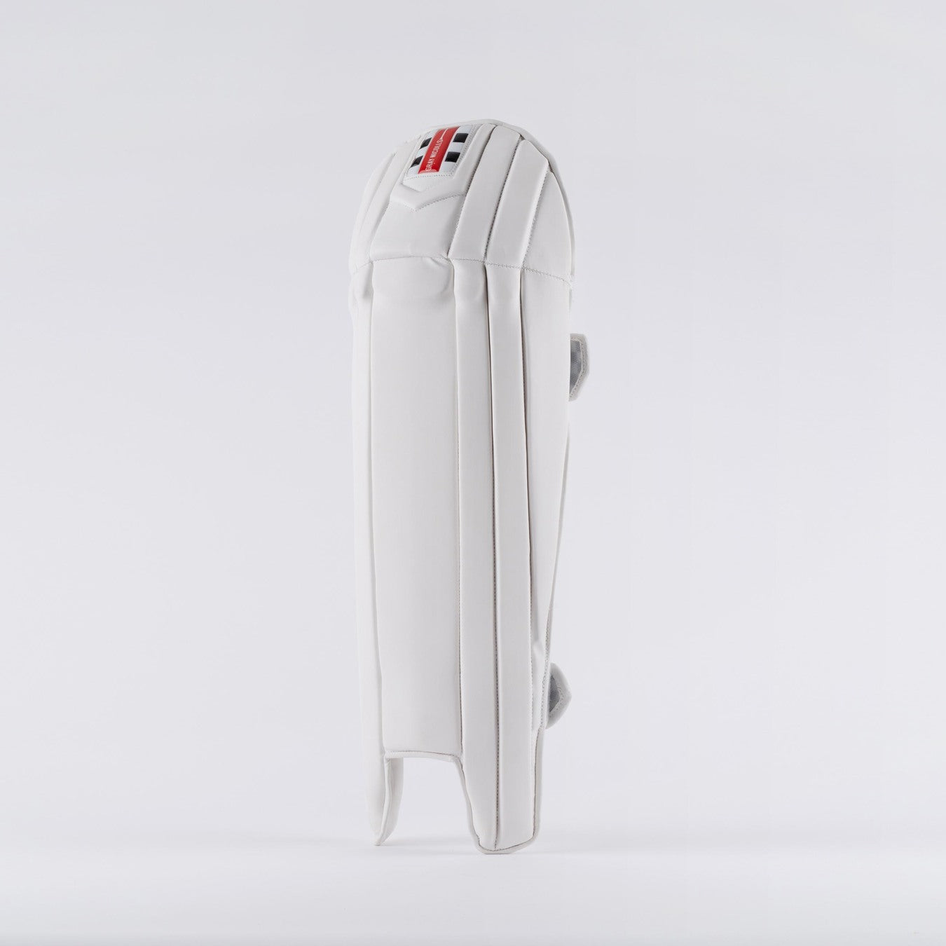 The Gray Nicolls Prestige Wicket Keeping Pads 2026 stands upright against a plain background, showcasing ergonomic knee design, detailed padding and stitching, and a small tricolor Gray Nicolls logo near the top.