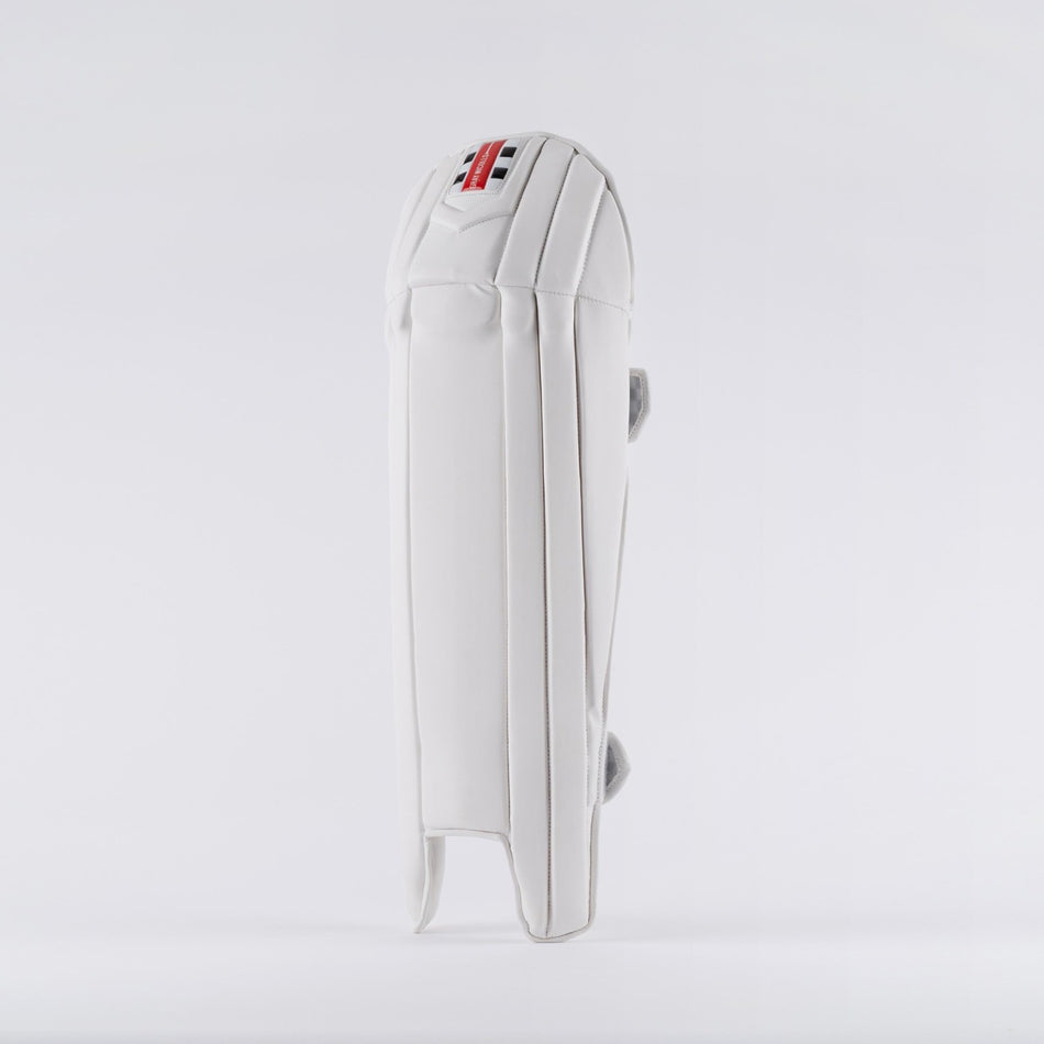 The Gray Nicolls Prestige Wicket Keeping Pads 2026 stands upright against a plain background, showcasing ergonomic knee design, detailed padding and stitching, and a small tricolor Gray Nicolls logo near the top.