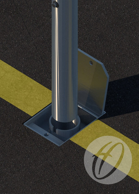 A Pink Netball Post from Harrod Sport, complete with locking sockets, is mounted on a square base plate fixed to asphalt near a yellow line. The pole’s shadow and the Harrod Sport circular logo appear on the pavement.