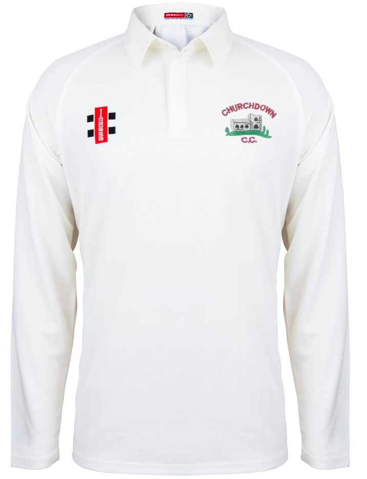 The Churchdown CC Matrix V2 Long Sleeve Shirt by Gray Nicolls is a white polyester cricket top featuring a collar and two embroidered chest logos—a Churchdown CC crest with clubhouse image and a rectangular sponsor logo.