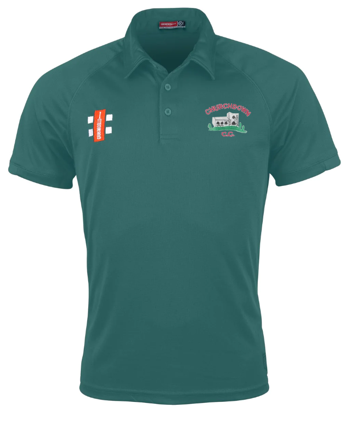 The Churchdown CC Matrix V2 Polo Shirt by Gray Nicolls is a teal short-sleeve polo with collar, button placket, embroidered logos—a red and white patch and CHAPELSMITH C.C. crest with building graphic—and Matrix V2 moisture-wicking fabric.
