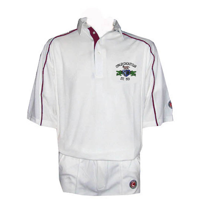 The Martin Berrill Sports Cowley CC 3/4 Sleeve Cricket Shirt features maroon piping, a maroon-trimmed collar, and Town Cricket Club Est. 1974 crest. Made from wick away fabric, it pairs with matching white trousers.