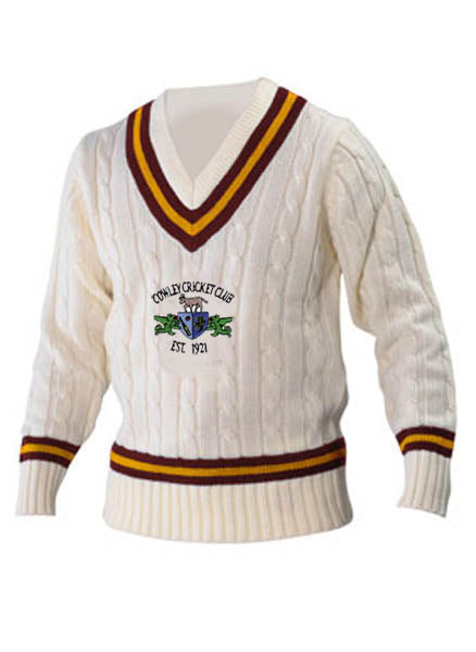 The Cowley CC Long Sleeve Sweater by Martin Berrill Sports features maroon and yellow striped trim, the Cowley Cricket Club logo, and “Est. 1974” on the chest—a perfect pick for fans of classic cricket style.