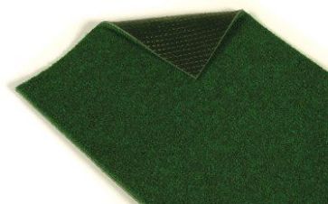 The Actionpitch Cricket Matting PVC Backing by Martin Berrill Sports is a rectangular artificial green grass mat with a textured black PVC backing, perfect for use as an indoor/outdoor mat or for cricket practice.