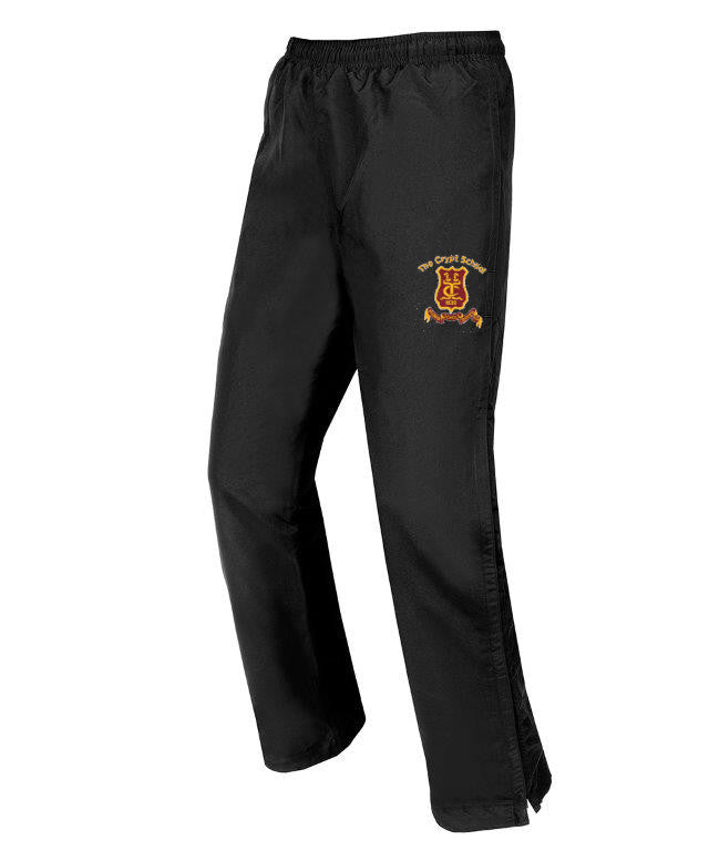 The Martin Berrill Sports Crypt School Junior Classic Stadium Pant is black, fully lined, with an elastic waistband, 3/4 leg zips, and features a yellow and red embroidered crest plus "The Crypt School" on the left thigh. Displayed on a white background.
