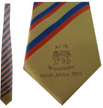 The Martin Berrill Sports Custom Club & School Ties feature yellow with red and blue stripes, a lion emblem, and "KCJS Wimbledon South Africa 2011" text—ideal for anyone seeking distinctive, personalized ties.