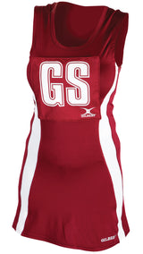 A sleeveless maroon/white Gilbert Eclipse Netball Dress featuring white side panels, a large GS patch on the front, and the Gilbert brand name printed on the women’s uniform.