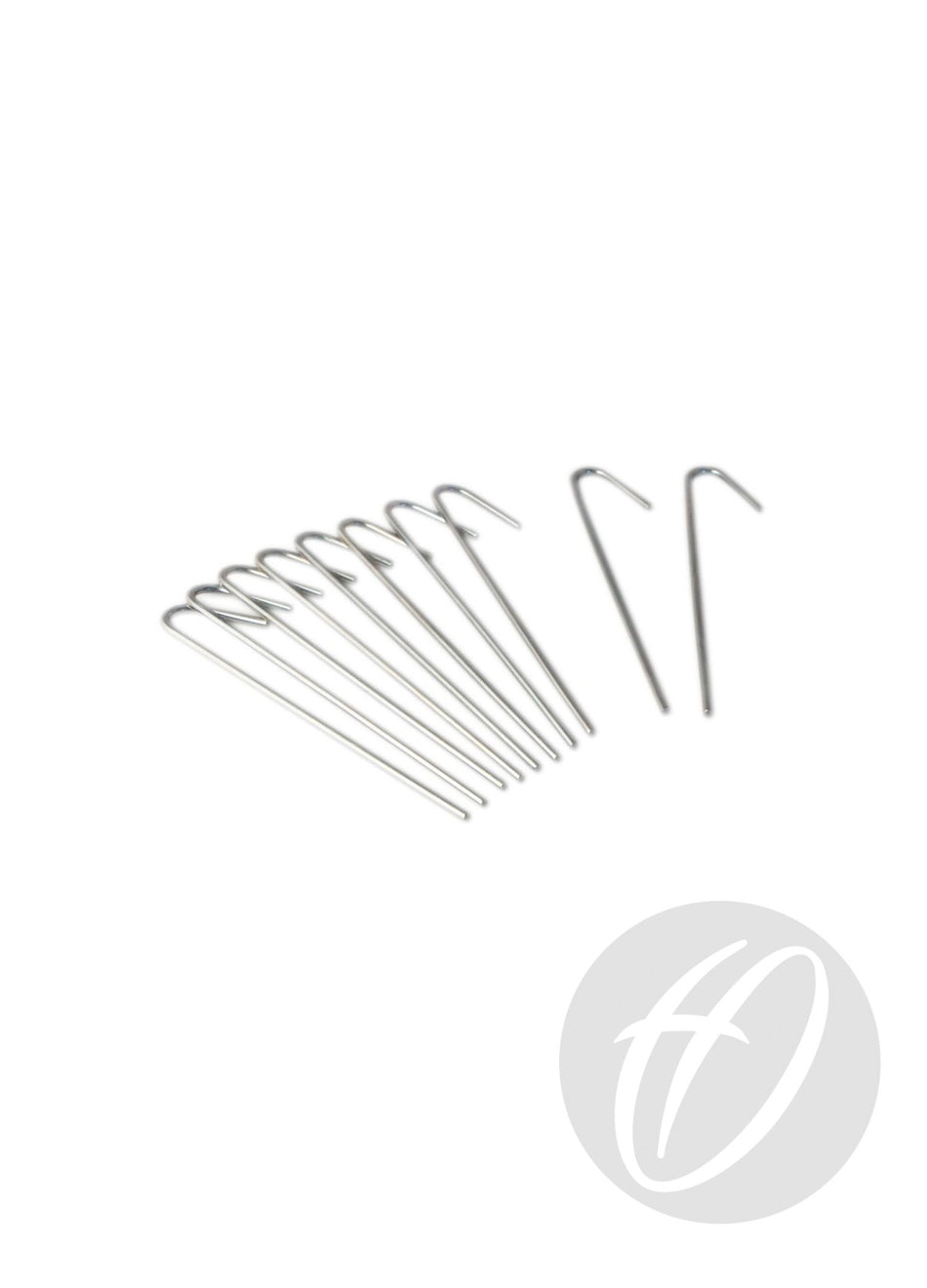 Eight Harrod Sport 180MM Steel Ground Pegs are arranged in a row, with two set apart to the right on a white background. A semi-transparent circular logo is visible in the lower right corner.