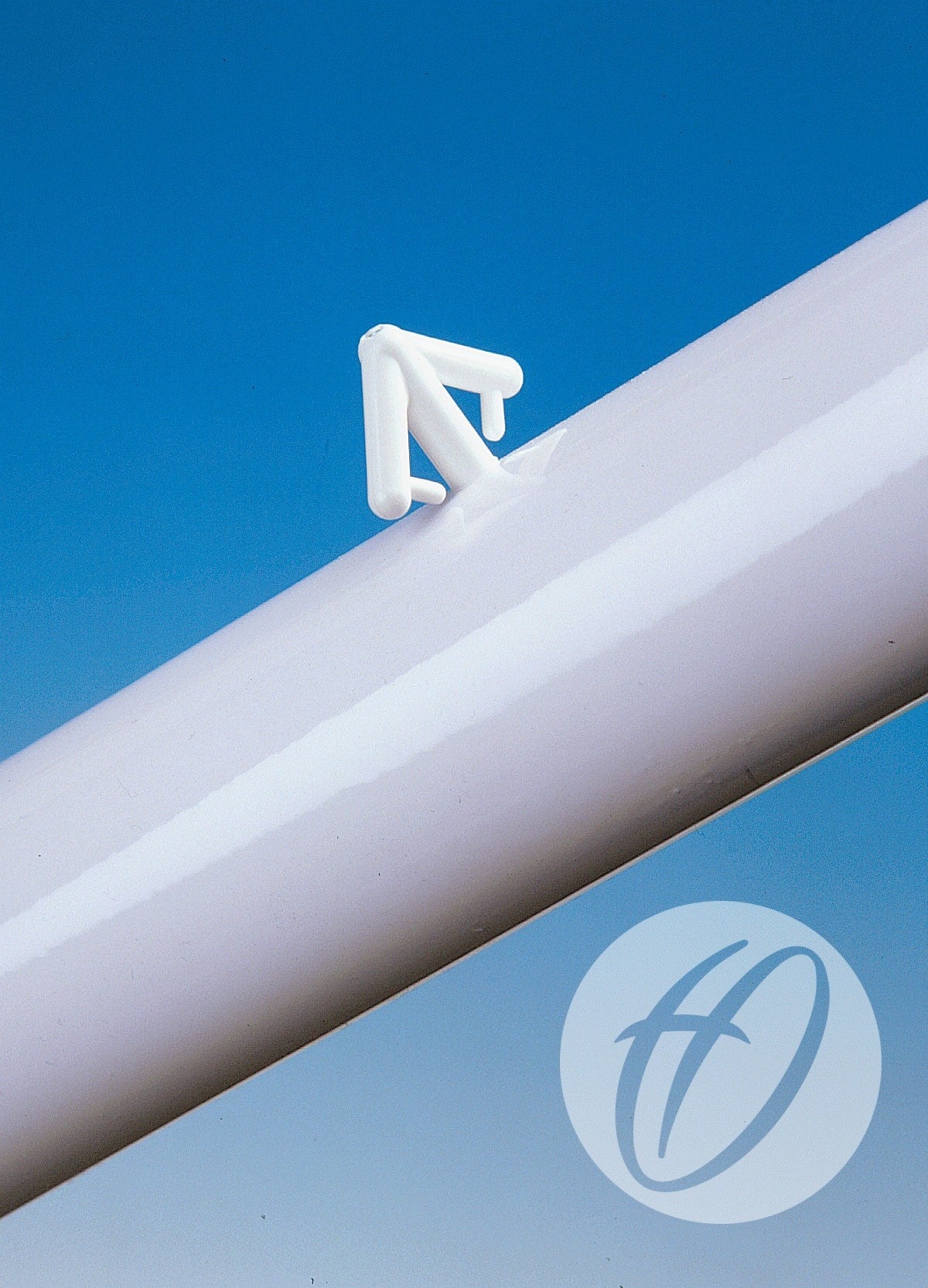 A pack of 12 Harrod Sport Synthetic Arrow Net Hooks, made from white plastic, is shown attached to a glossy white tube against a blue background with a stylized H logo watermark in the lower right corner.