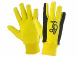 Kookaburra Plain Cotton Inner Gloves by Kookaburra: yellow gloves with black textured grips and a black penguin logo, shown on a white background—perfect as wicket keeping gloves or as comfortable cotton inners.